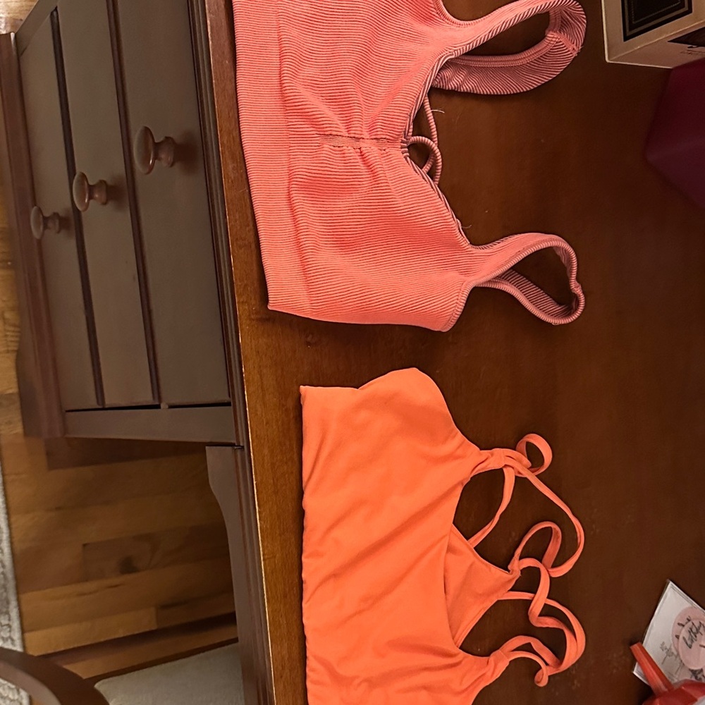 Two Fabletics Coral and Orange Sports Bras